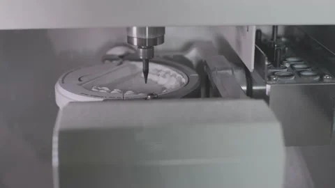 A professional CNC machine automatically creates a tooth prosthesis. The drill Stock Footage 146912537