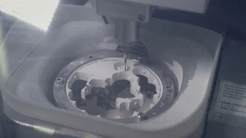 A professional CNC machine automatically creates a tooth prosthesis. The drill Stock Footage 146914042