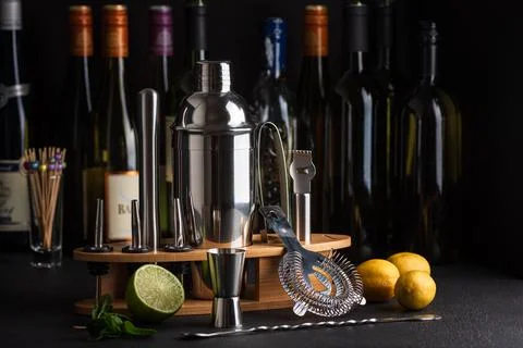 Professional cocktail bar composition featuring a stainless steel shaker, j.. Stock Photos