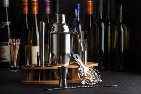 Professional cocktail bar composition featuring a stainless steel shaker, j.. Stock Photos