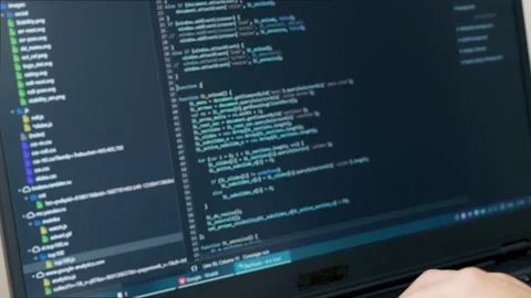A Professional Coder Writes a Script on a Laptop. The Developer Encodes. The Pro Vidéo 145582198