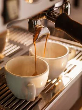 Professional coffee brewing. Close-up of two espresso Stock Photos