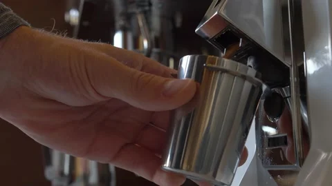 Professional Coffee Grinder Grinding Coffee Beans into Metal Dosing Cup Video stock 166338591