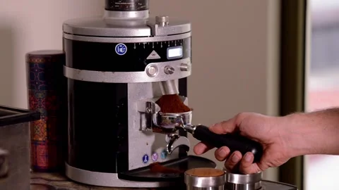 Professional Coffee grinder grinding coffee beans 動画素材 166985896