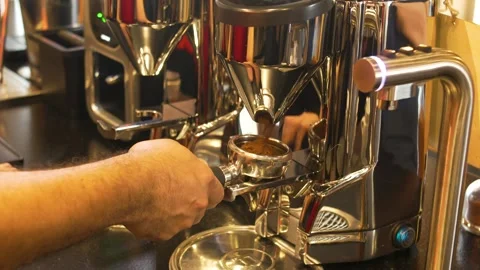 Professional Coffee Grinding Process with Barista Dosing Grounds into Stock Footage 336038559