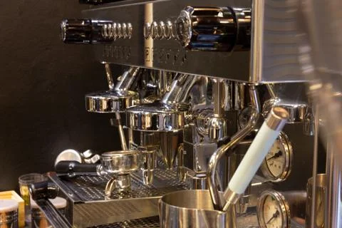 Professional coffee machine making a cup of coffee in cafe Stock Photos