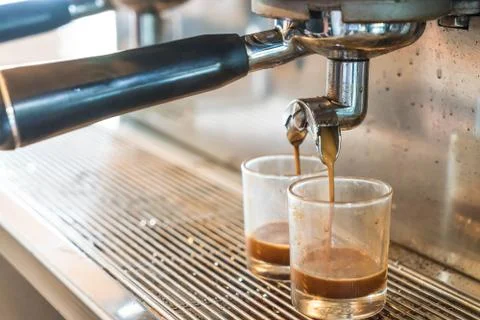 Professional coffee machine making espresso in a cafe Stock Photos