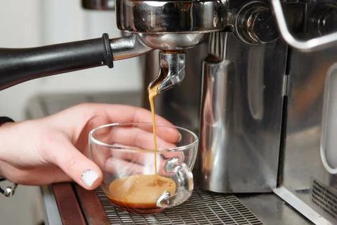 Professional coffee machine making espresso in a cafe Stock Photos