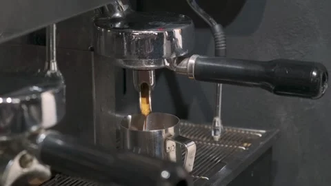 Professional coffee machine making hot espresso shot or americano in coffee shop Stock Footage 251704238