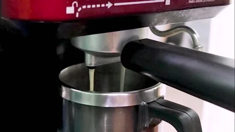 Professional coffee maker serving hot espresso in a cup Stock Footage 200784650