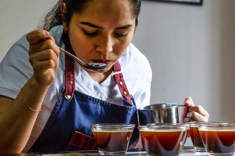 Professional coffee taster testing new smells and flavors. Stock Photos