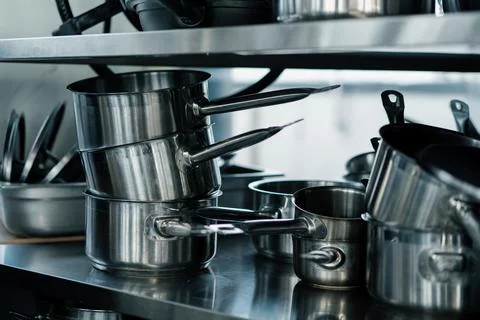 Professional commercial empty clean modern kitchen in restaurant or cafe Metal Stockfoto's