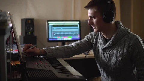 Professional composer quits and goes into the studio Stock Footage 72289628