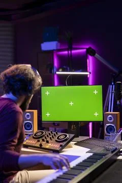 Professional composer working with mixing console and electronic keyboard 写真素材