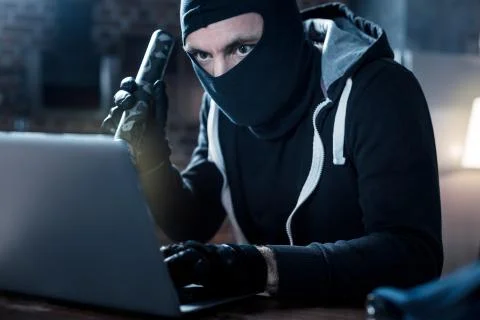 Professional computer hacker stealing data Foto stock