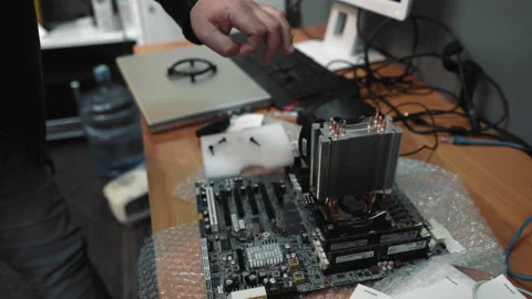 Professional computer wizard assembles a new motherboard to computer from Stock Footage 134332187