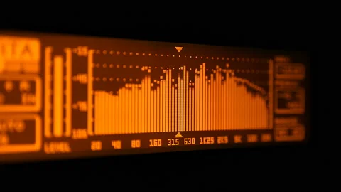 The professional concert equalizer has a yellow spectrum analyzer on the display Stock Footage 142304317
