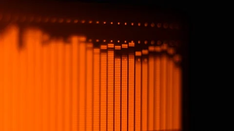 The professional concert equalizer has a yellow spectrum analyzer on the display Stock Footage 142336424