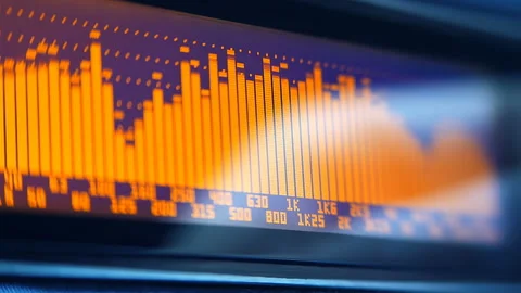The professional concert equalizer has a yellow spectrum analyzer on the display Stock Footage 142375486