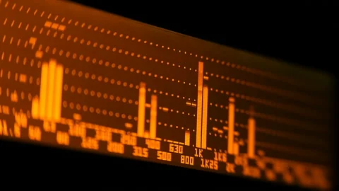 The professional concert equalizer has a yellow spectrum analyzer on the display Stock Footage 142381848