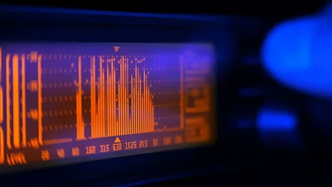 The professional concert equalizer has a yellow spectrum analyzer on the display Stock Footage 142414398