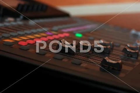 Professional concert mixing console long-stroke faders. Close-up Stock Photos