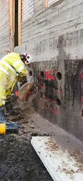 Professional concrete cutting tools on active construction site Foto stock