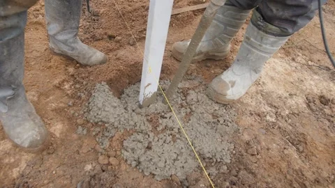 Professional Concrete Installation for Structural Support at Construction Stock Footage 302112433