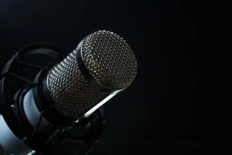 Professional condenser studio microphone on the black background Foto stock