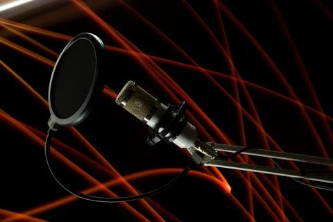 Professional condenser studio microphone on the black background and freezeli Stock Photos