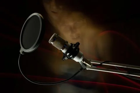 Professional condenser studio microphone on the black background and freezeli Stock Photos