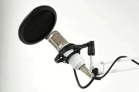 Professional condenser studio microphone on the white background Stock Photos