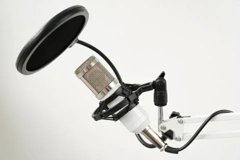 Professional condenser studio microphone on the white background Stock Photos