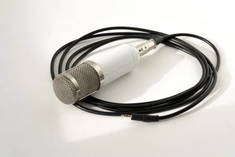 Professional condenser studio microphone on the white background Photos
