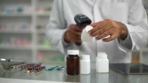 Professional confident Pharmacist in checking stock inventory in medical store. Stock-Footage 249718246