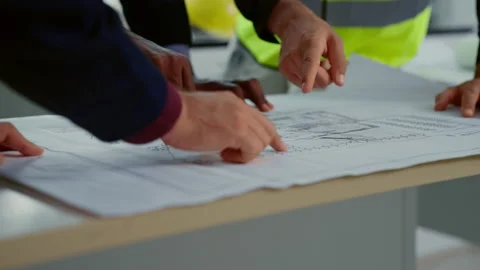 Professional construction engineers using blueprint brainstorming Stock Footage 237618291