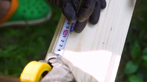 Professional Construction Worker Ensuring Board Accuracy Stock Footage 247523702