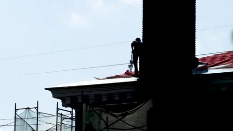 Professional construction worker installing new red. Russia - 04 September 2026 库存影片 341833530