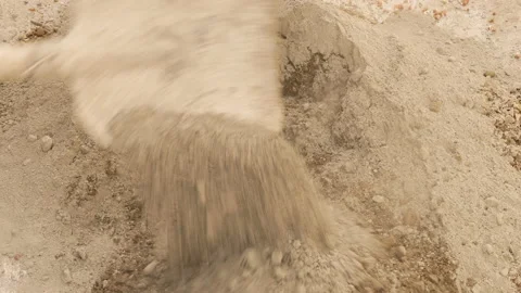 Professional construction worker mixes manually wet grey cement. close-up Stock Footage 154676389