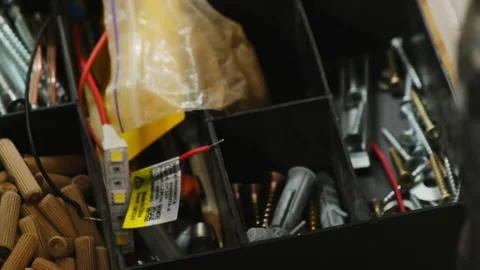 Professional construction worker searches for specific screws Stock-Footage 304402444