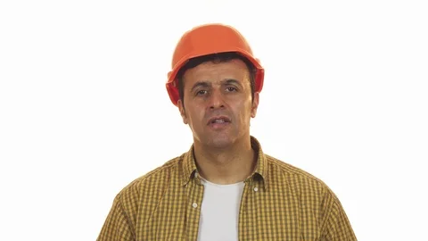 Professional constructionist looking shocked taking off his hardhat Stock Footage 85975256