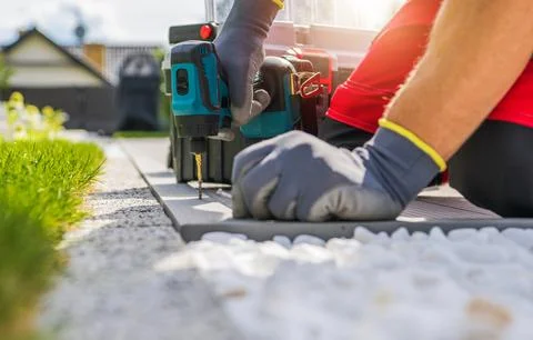 Professional Contractor Worker Building Composite Outdoor Patio Deck Stock Photos