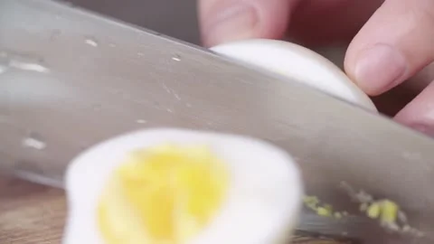 Professional Cook Cutting Boiled Egg 4K, HD Slow Motion Video stock 145797639