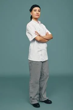 Professional cook standing in a studio Stock Photos