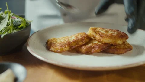 Professional Cook Stylishly Serving Crust Golden Potato Pancakes on Dish. Stock Footage 196259068