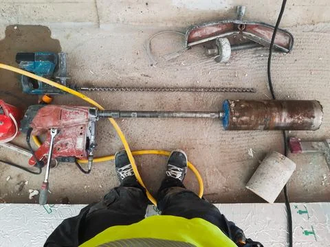 Professional core drill operator POV after job is done Stock Photos