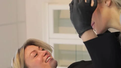 Professional correction of the shape of eyebrows, removal of unwanted hair Stock Footage 264072241