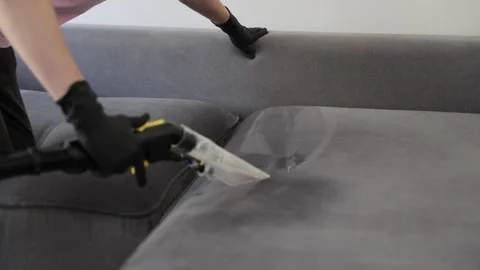 Professional couch cleaning with advanced vacuum technology for best results. 動画素材 321513877