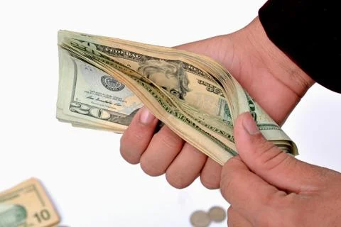 Professional counting the currency notes dollars in hand Stock Photos