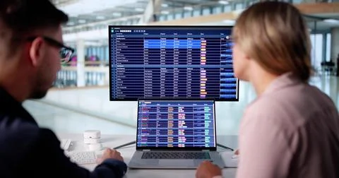 Professional Couple Analyzing Financial Data For Business Audit Using Compute Foto stock
